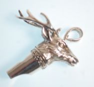 A stamped Sterling silver whistle pendant in the form of a stag with moulded detailing. Weight