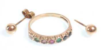 A hallmarked 9ct gold ring set with seven round cut coloured stones. Hallmarked Birmingham 1987.