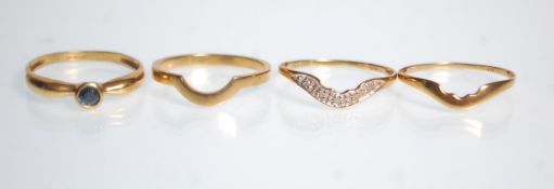 A hallmarked 9ct yellow gold ladies ring ring set with a central blue. Ring size R. Together with