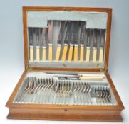 A 20th Century cutlery canteen housing Roberts and Dore cutlery including an ivorine handled carving