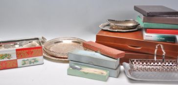A collection of silver plated wares to include two cutlery canteens including one being wooden cased