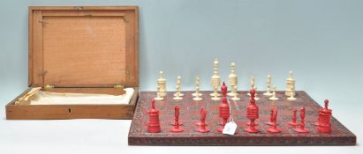 A superb 19th Century Victorian English bone and red stained first edition chess set with turned