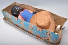 A vintage original pedigree made doll in the form of a black baby having open / shut eyes action ,