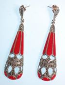 A pair of stamped 925 silver ladies earrings having drops set with marcasites and red enamelled