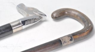 A contemporary walking stick cane having a white metal horse head handle and ebonised tapering shaft