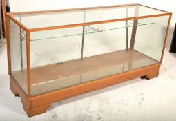 A large early 20th century haberdashery - shop display counter cabinet of rectangular form being