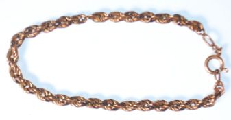 A stamped 375 9ct gold bracelet having a rope twist chain with a spring ring clasp. Measures 8