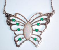 A stamped 925 silver necklace having a butterfly pendant set with a central opal panel and round cut