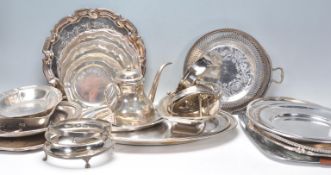 A mixed group of silverplate wares dating from the early 20th Century to include mostly trays with