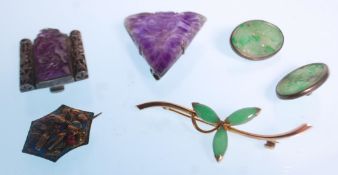 A collection of jade and amethyst jewellery to include two Chinese carved amethyst lapel brooches