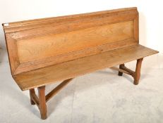 A 19th century Victorian rustic pine church bench pew / hall settle. Raised on shaped supports