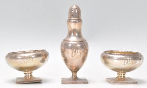 A pair of sterling silver table salts of bulbous form having open top with gadrooned borders