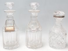 A good pair of 19th century heavy lead glass decanters of shaped and angled form complete with