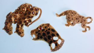 A group of three vintage fashion brooches in the form of leopards to include one in the form of