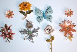 A collection of six vintage mid 20th Century brooches to include a blue enamelled flower brooch