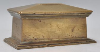 A 19th Century bronze trinket / desk box of sarcophagus form having a lift up cover revealing a