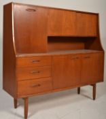 Brasilia - A retro 20th Century teak wood G-Plan highboard sideboard credenza, being raised on