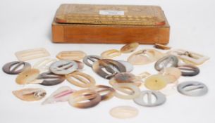 A collection of mother of pearl belt buckles including round, oval and rectangular shaped buckles
