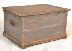 A Victorian 19th century painted pine blanket box chest of smaller proportions being raised on