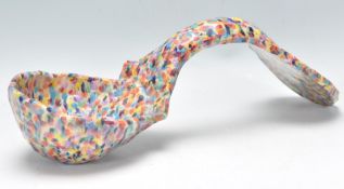 A 20th Century folk art large ladle with hand painted with multiple colours. Measures 39cm long.