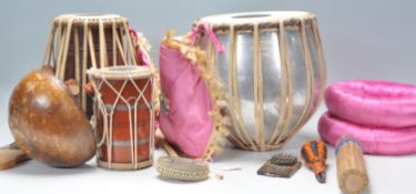 A pair of 20th Century Indian Tabla drums having polished metal casing with hide tops. Together with