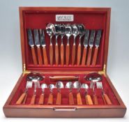 A good vintage retro 20th Century mahogany cased canteen of cutlery housing a complete set of teak