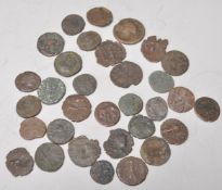 A collection of 33 Various Roman and Greek Coins of hammered type, many with details remaining.