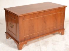 A good quality yew wood Regency revival blanket box chest being raised on bracket feet with