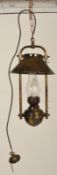 A contemporary antique style large brass hanging lantern of oil lamp type with modern electric