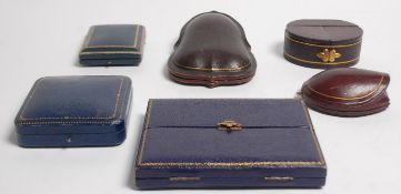 A group of six early 20th Century antique jewellery boxes of varying sizes and shapes, being