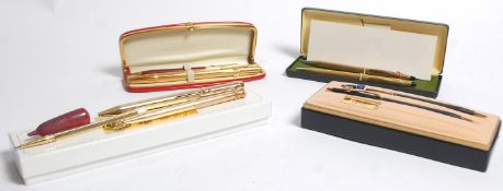 A good mixed collection of pens to include a two pen boxed Cross pen set and another boxed example