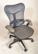 A Herman Miller Mirra 2 office desk chair in a blue and grey colourway with an adjustable mesh