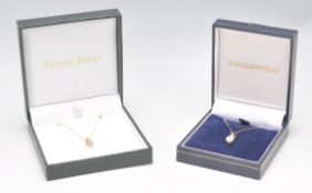 A 9ct gold and diamond necklace pendant and chain. The 2 stone diamond within chevron setting.