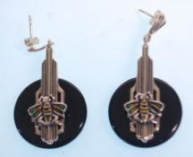 A pair of stamped sterling silver earrings set with black stone panels and bees with enamelled