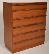 A retro 20th century teak wood Avalon chest of drawers. The upright body with a bank of six drawers