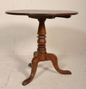 A George III 19th century country oak tilt top wine table / breakfast table. Raised on cabriole
