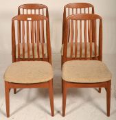 A good set of mid century Danish teak wood dining chairs being raised on turned legs united by