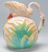 A 20th Century vintage ceramic jug in the form of a swan, the neck modelled into a handle having