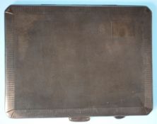 A good silver hallmarked cigarette case of rectangular form having engine turned decoration and gilt