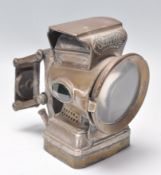 An early 20th century vintage bicycle lamp by Silver King. The lamp with original clasp to back with