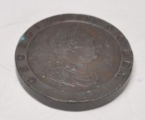 A 18th Century George III 1797 bronze britannia penny with the kings head facing right and Britannia