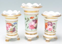 A 19th century Victorian porcelain 3 piece garniture vase set in the manner of Minton. Each of