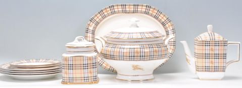 A Burberry pattern part dinner service to include turreen, plates, tea pot, sugar pot and platter,