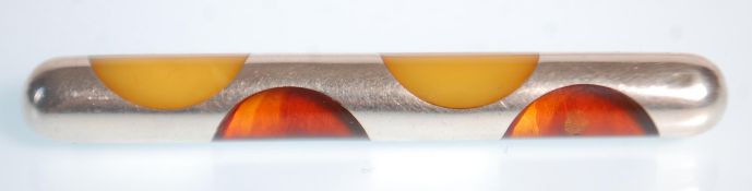 A good mid 20th Century 925 silver brooch of stylish rounded rectangular form set with amber.