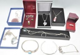 A group of silver jewellery to include a necklace chain and pendant having abalone shell decoration,