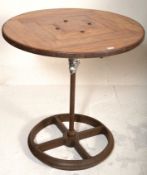 A good 20th century upcycled Industrial cafe table. Raised on Industrial trolley - tram wheel base