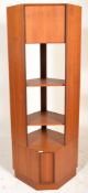 A mid century retro teak wood G-Plan corner upright bookcase cabinet being raised on a plinth base