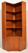 A mid century teak wood corner cabinet in the manner of G-Plan. Raised on an inset plinth base