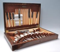 A vintage Webber and Hill cutlery canteen being wooden cased filled with silver plate cutlery and