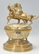 A stunning early 20th Century large bronze table / desk inkwell having horse figures atop the cover.